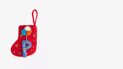Colorful decorative sock with letter P, perfect for Christmas festivities and holiday decorations.