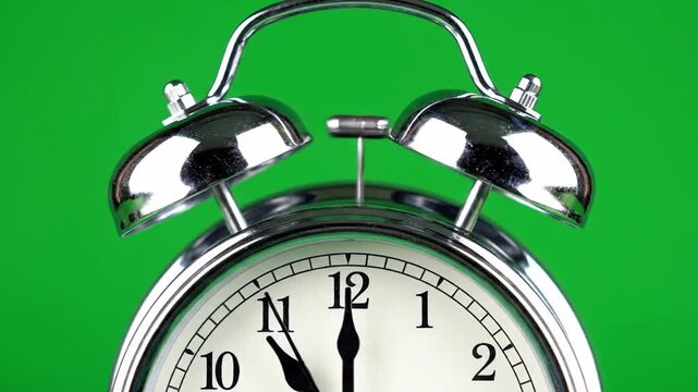 Alarm Clock Ringing on Green Background - Time Management Concept.