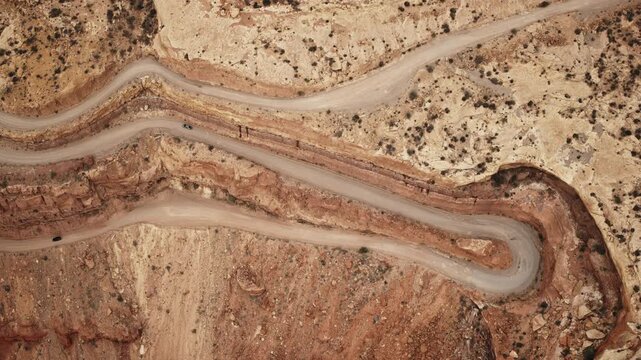 Aerial flyover of cars traveling on the Moki Dugway near Mexican Hat, UT