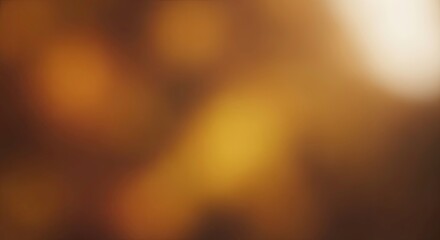 Abstract blurred golden light background with bokeh effect, creating a warm and dreamy atmosphere