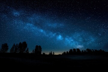 Night Sky Displaying The Milky Way Over Silhouette Trees Dark Blue And Black Tones