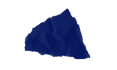 A single crumpled piece of dark blue paper isolated against a stark black background in a studio shot