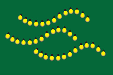 Festive yellow string lights on a green background for holiday celebrations