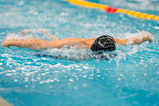 Swimmer performing freestyle stroke during training