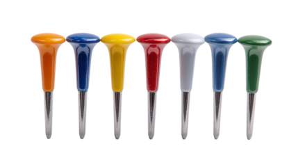 A vibrant line of seven colorful golf tees stands upright against a dark black background