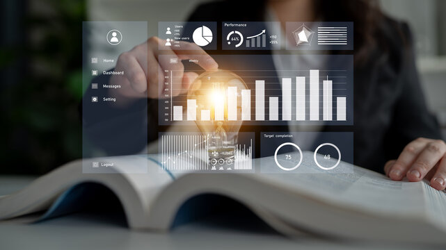 A business professional engages with digital data visuals above an open book, merging traditional and modern methods of analysis for effective insights. Impute