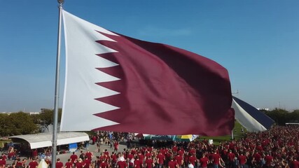 Qatar pride celebration in vibrant city square with waving national flag, capturing a sense of unity and patriotism during a national holiday event