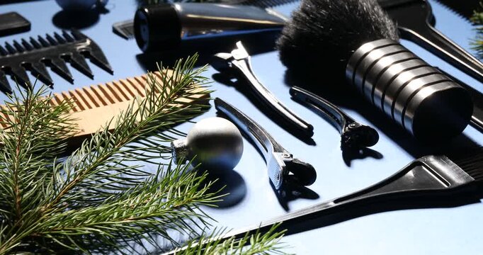 Hairdresser's tools and Christmas decor on light blue background, closeup - Powered by Adobe