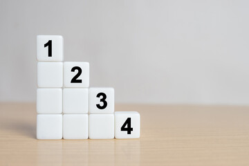 Task priority and management concept. The order of priority in any activity. Set work priority, arrange to do list. Dice with number first, second, third and fourth