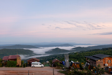 Picturesque Mountain Village View with Mist at Sunrise