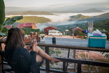 Woman Drinking Coffee with Mountain View
