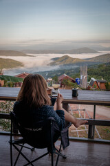 Woman Drinking Coffee with Mountain View