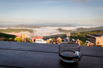 Coffee Cup on Table with Mountain View