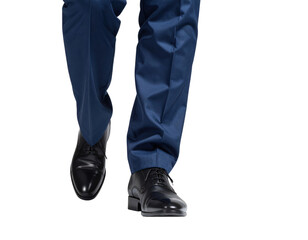 Closeup of a mans legs in a blue suit and black dress shoes walking forward.