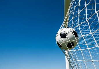 Soccer Ball Hitting the Back of the Net Against Clear Blue Sky, Goal and Victory Moment