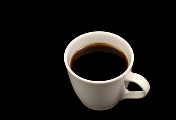 Fototapeta premium A single cup of coffee, dark roast, isolated on a black background, vibrant, black