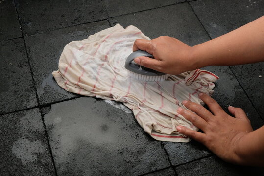 scrubbing fabric with detergent - Powered by Adobe