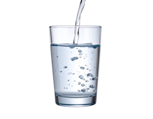 A clear glass being filled with water, with bubbles forming as the liquid is poured in