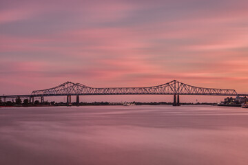 New Orleans Bridge With Fiery Pink Sunset in the Evening