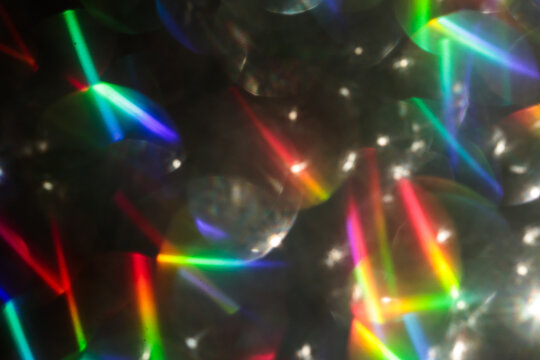 Colorful glitter rainbow glow light flare sparks abstract overlay texture - Powered by Adobe