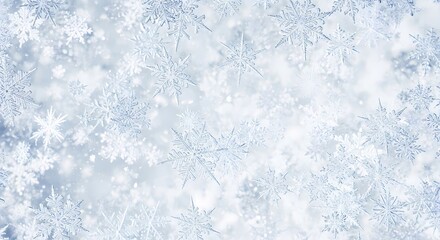 A close-up view of intricate snowflakes against a soft blue and white background, creating a delicate winter pattern.