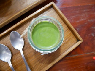 Green tea in a glass, ready to drink