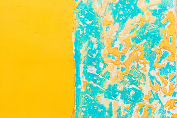 Vibrant yellow and turquoise peeling paint wall texture with bold contrasting color blocks cracked layers weathered surface details abstract organic patterns chipped paint edges rugged artistic