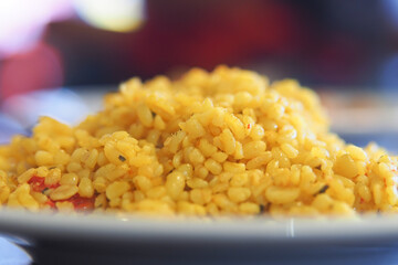 Savory yellow rice dish served on a plate