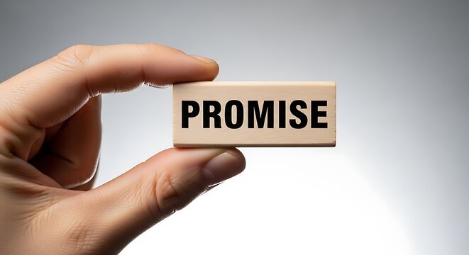 Hand holding a wooden block with the word promise isolated on white background - Powered by Adobe