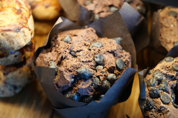 Chocolate muffins with dark chocolate chips on display