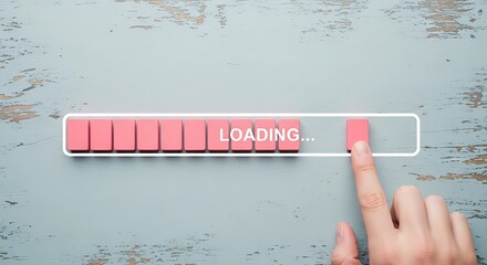 Loading progress bar concept with hand touching the loading bar on table