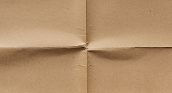 Brown craft paper bisected by perpendicular creases creating four distinct quadrants