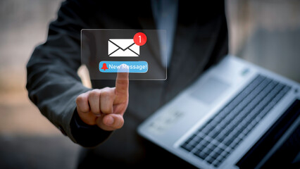 Businessman touching new message notification icon on virtual screen,email alert, online messaging system, representing digital communication, instant response, and business connectivity.
