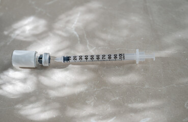 Close up of Small Vial with Medicine or HRT and Single Use Syringe