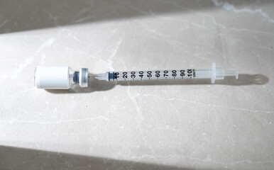 Close up of Small Vial with Medicine or HRT and Single Use Syringe