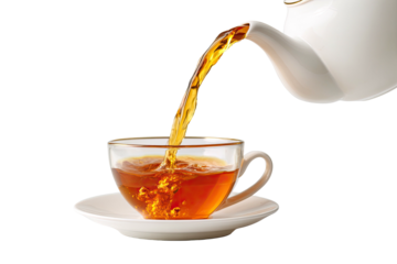 Tea poured in clear cup, white teapot, dark background