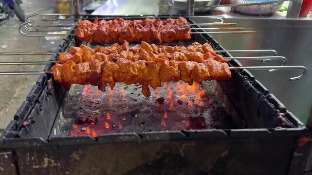 Chicken tikka kebab being prepared in Kolkata style in a roadside stall.
