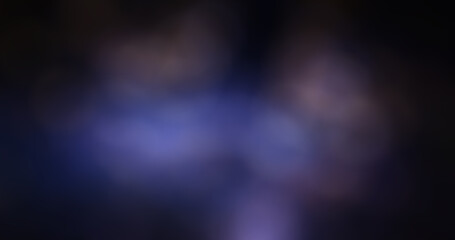 Abstract blurred purple and blue light leaks on dark background, soft out-of-focus bokeh effect with smooth gradient tones for modern design, wallpaper, or tranquil backdrop