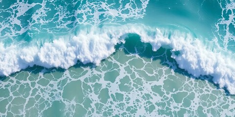 Deep azure ocean waves crashing on a sandy shore, texture, landscape