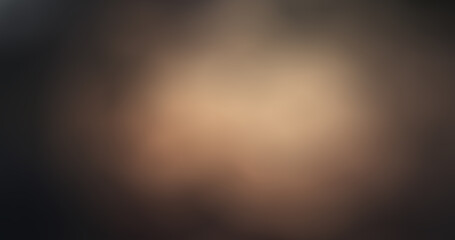 Soft blurred warm golden brown and dark gradient background creating a tranquil, smooth, and elegant abstract atmospheric texture for design templates
