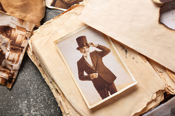 Old album with photos of relatives on grunge background. Concept of family tree