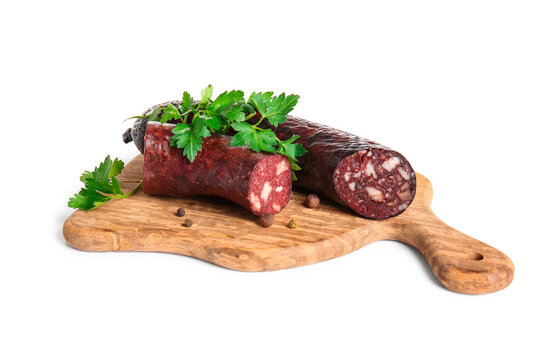 Cutting board with delicious blood sausage and fresh parsley isolated on white background
