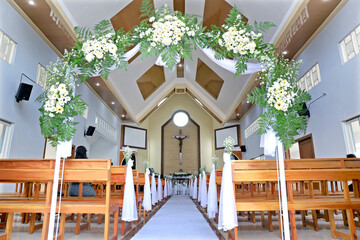 Bright Christian Church Altar and Aisle Decorated for Wedding Ceremony