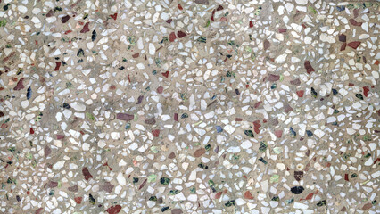 Terrazzo stone tile texture with multicolored marble chips in cement.
