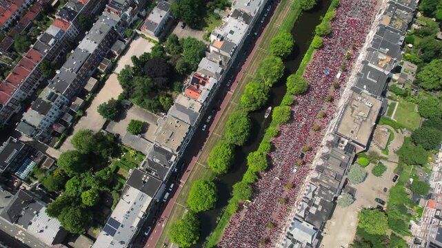 Free Palestine protest Drone aerial shows massive group of people on highway in the Hague, top down view