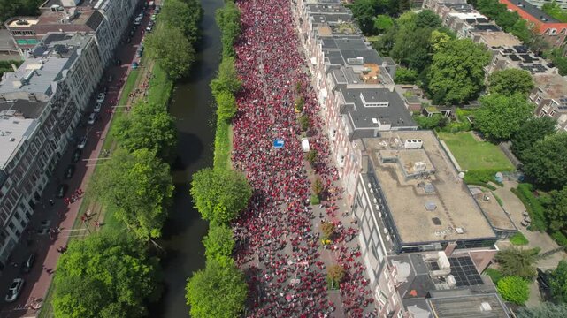 Free Palestine protest Drone aerial shows massive group of people on highway in the Hague, top down view