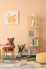 Fototapeten Pony Interior of children's room with bookshelf, table and toys  © Pixel-Shot