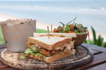 club sandwich on wooden plate