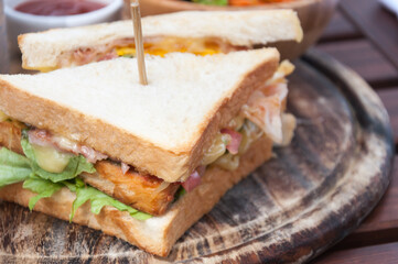 club sandwich on wooden plate