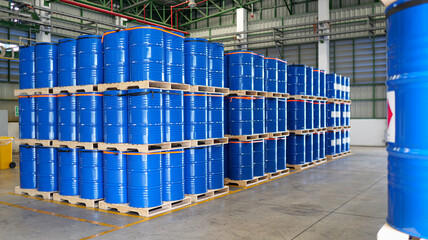 chemical barrels on wooden pallets, organized warehouse storage, industrial drums ready, safe chemical handling, shipment preparation